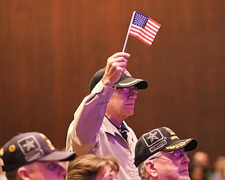        ROBERT K. YOSAY  | THE VINDICATOR..Forrest Lytell  a navy vet.. waves the flag proudly as the band saluted each branch of service..33rd Veterans Day Program as Junior and Seniors gathered in the Auditorium to honor those that served our country .. - -30-...