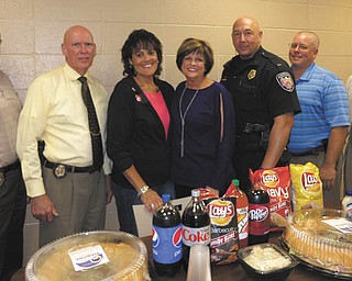 SPECIAL TO THE VINDICATOR
Austintown Junior Women’s League recently delivered lunch to Austintown Police Department to show respect and appreciation for their work. Members and officers present, from left, are Detective Doug Scharsu, Captain Bryan Kloss, AJWL members Ruty Rodriguez-Patterson and Kathy Rusback, Lieutenant Thomas Collins, Detective Shawn Hevener and Chief Robert Gavalier. For information on the league, visit www.facebook.com/AJWL2014.