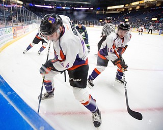 Scott R. Galvin | Vindicator .Youngstown Phantoms forward Coale Norris (44) and Youngstown Phantoms forward Griffin Loughran (14) dig for the puck in the corner against Bloomington Thunder during the first period at the Covelli Centre on November 12, 2016.