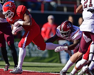 YOUNGSTOWN, OHIO - NOVEMBER 12, 2016: Running back Tevin McCaster #37 of YSU crosses the goal line to score a touchdown after breaking free from linebacker Withney Simon #42 of Southern Illinois during the first half of their game Saturday afternoon at Stambaugh Stadium. YSU won 21-14. DAVID DERMER | THE VINDICATOR