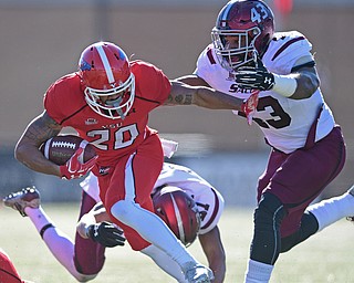 YOUNGSTOWN, OHIO - NOVEMBER 12, 2016: Running back Jody Webb #20 of YSU runs the ball while fighting ff tacklers Deondre Barnett #43 and Jefferson Vea #24 of Southern Illinois during the first half of their game Saturday afternoon at Stambaugh Stadium. YSU won 21-14. DAVID DERMER | THE VINDICATOR