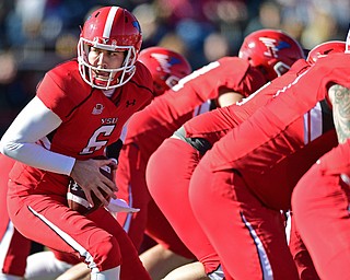 YOUNGSTOWN, OHIO - NOVEMBER 12, 2016: Quarterback Hunter Wells #6 of YSU turns to hand the ball off after taking the snap from center during the first half of their game Saturday afternoon at Stambaugh Stadium. YSU won 21-14. DAVID DERMER | THE VINDICATOR