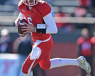 YOUNGSTOWN, OHIO - NOVEMBER 12, 2016: Quarterback Hunter Wells #6 of YSU rolls out to pass during the first half of their game Saturday afternoon at Stambaugh Stadium. YSU won 21-14. DAVID DERMER | THE VINDICATOR