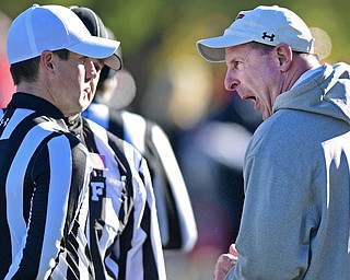 YOUNGSTOWN, OHIO - NOVEMBER 12, 2016: Head coach Bo Pelini argues with head referee Rich Edwards on the sideline during the second half of their game Saturday afternoon at Stambaugh Stadium. YSU won 21-14. DAVID DERMER | THE VINDICATOR