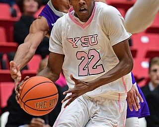 YOUNGSTOWN, OHIO - NOVEMBER 12, 2016: Rahim Williams #22 of YSU holds on to the ball while avoiding the swipe from Josh Williams #1 of Akron during the first half of their game Saturday night the Beeghly Center. DAVID DERMER | THE VINDICATOR