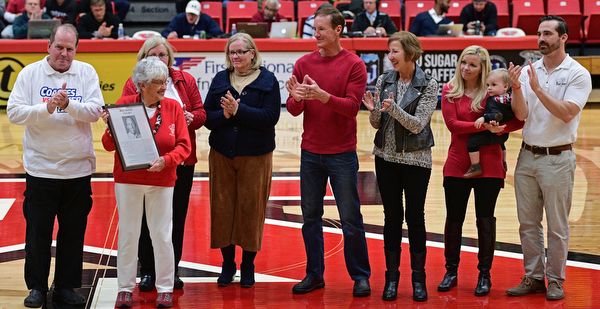 YOUNGSTOWN, OHIO - NOVEMBER 12, 2016: Nancy Dailey, the mother of for YSU men's basketball coach Bill Dailey, smiles while standing on the court with the extended family of former YSU men's basketball coach Bill Dailey, at halftime of Saturday nights game. DAVID DERMER | THE VINDICATOR