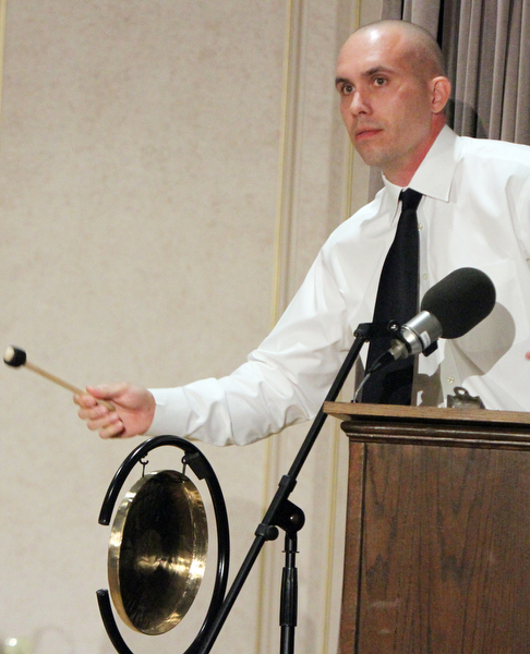 William D. Lewis The Vidnicator Phil Kidd sounds the gong which signaled the opening of City Club of the Mahoning Valley panel discussion at Stambaugh auditorium Nov. 15, 2016