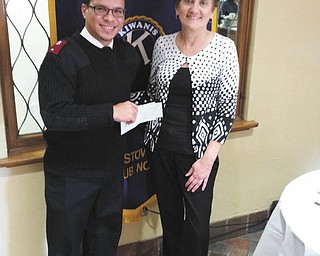 SPECIAL TO THE VINDICATOR
Kiwanis Club of Youngstown donated $750 to the Salvation Army of Mahoning County on Oct. 28. The funds will support Salvation Army’s Thanksgiving dinner and Christmas gift programs. Carla Hunter, Kiwanis president, right, presented the check to Jorge Munoz, Salvation Army lieutenant and fellow Kiwanis member. The army provides financial, social and spiritual services for at-risk community members, and expects to feed more than 400 people at its Thanksgiving dinner. Kiwanis Club serves children around the world. The club supports many local organizations including Rescue Mission of the Mahoning Valley, Making Kids Count, CityScape, Neighborhood Ministries, Butler Institute of American Art, Salvation Army bell ringing, Meals on Wheels and more. The club meets at noon every Friday at the YMCA, 17 N. Champion St., Youngstown, guests are welcome. For information about Kiwanis call Chris McCarty at 330-729-1017 or 310-948-8858.
