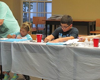 Neighbors | Alexis Bartolomucci.Children worked on their owl paintings at the Poland library on Oct. 13 during the Halloween Painting Party.
