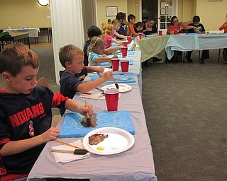 Neighbors | Alexis Bartolomucci.Children at the Poland library painted in their owls during the Halloween Painting event on Oct. 13.