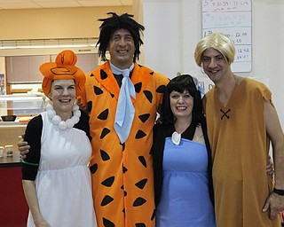 Neighbors | Abby Slanker.Canfield Village Middle School Principal Judd Rubin dressed as Fred Flintstone, with CVMS Assistant Principal Mike Flood dressing as Barney Rubble for the school’s annual Halloween dress up day. School secretaries Diane Pacifico and Barb Noll dressed as Betty Rubble and Wilma Flintstone, respectively, on Oct. 28.
