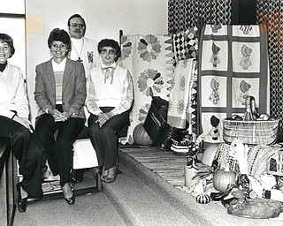 Remembering: The pastor and several members of Living Lord Lutheran Church, Howland, display some of the many symbols of the past which will adorn the sanctuary a the 7:30 pm. Thanksgiving service on Wednesday. From left are Kay Fisher of Warren, chairman of the worship committee; Georgia Koehler and Anne MOrgan of Howland,; and the Rev. Dean Sanberg, pastor (in the rear)..The Vindicator/ Choo H. Ng