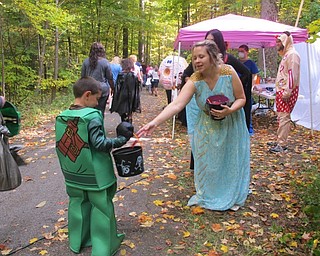 .Neighbors | Alexis Bartolomucci.A child dressed as a Lego Teenage Mutant Ninja Turtle went trick or treating in the woods during Boardman Park's Boo thru the Woods event on Oct. 16.