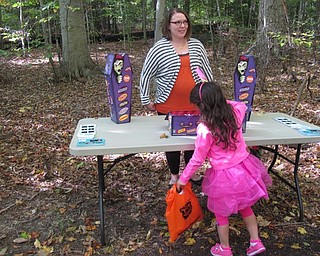 Neighbors | Alexis Bartolomucci.Giulia picked a piece of cfandy from one of the vendors at the Boo thru the Woods event on Oct. 16 at Boardman Park.