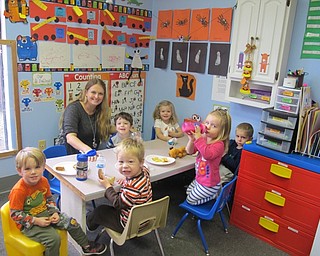 Neighbors | Alexis Bartolomucci.Students enjoyed their lunches in the toddler room with their teacher, Heather, at Hitchcock Woods Preschool.
