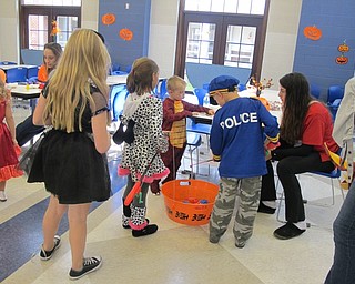 Neighbors | Alexis Bartolomucci.Children at the Halloween Carnival at McKinley Elementary on Oct. 29 took turns fishing for different prizes.