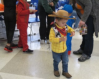 Neighbors | Alexis Bartolomucci.One of the children at the Halloween Carnival on Oct. 29 at McKinley Elementary carried a piece of candy corn on a spoon to the finish line without dropping it.