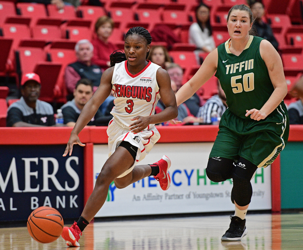 YOUNGSTOWN, OHIO - NOVEMBER 23, 2016: Indiya Benjamin #3 of YSU dribbles up court while being pursued by Bre Nauman #50 of Tiffin during the first half of their game Wednesday night at the Beeghly Center. DAVID DERMER | THE VINDICATOR