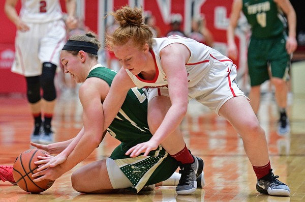 YOUNGSTOWN, OHIO - NOVEMBER 23, 2016: Kelly Wright #35 of YSU attempts to wrestle the ball away from Allie Miller #23 of Tiffin during the first half of their game Wednesday night at the Beeghly Center. DAVID DERMER | THE VINDICATOR