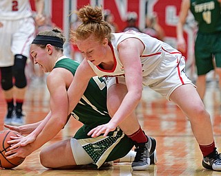 YOUNGSTOWN, OHIO - NOVEMBER 23, 2016: Kelly Wright #35 of YSU attempts to wrestle the ball away from Allie Miller #23 of Tiffin during the first half of their game Wednesday night at the Beeghly Center. DAVID DERMER | THE VINDICATOR