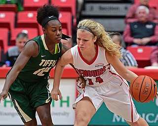 YOUNGSTOWN, OHIO - NOVEMBER 23, 2016: Melinda Trimmer #14 of YSU dribbles up court while protecting the ball from Kristen Massey #12 of Tiffin during the first half of their game Wednesday night at the Beeghly Center. DAVID DERMER | THE VINDICATOR
