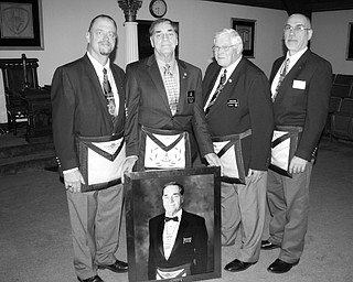 SPECIAL TO THE VINDICATOR
Members of the 24th Masonic District recently presented a portrait of Russell W. Gillam Jr. of Canfield to the Argus Masonic Lodge of Canfield. Gillam has served the Grand Lodge of Ohio as a district deputy grand master for three years. His appointments were made at Grand Lodge sessions in Akron, Cincinnati and Columbus, and he is the third member in the 130-year history of the lodge to attain this honor. Gillam has presided over the Youngstown Chapter of Royal Arch Masons, Buechner Council Royal and Select Masons and St. John’s Commandery Knights Templar in the York Rite. He has served as worshipful master in 1979 and 2013, and as thrice potent master and most wise master in the Scottish Rite of Freemasonry. He has been awarded for meritorious service in the Ohio Council of Deliberation of the Scottish Rite and received the York Cross of Honour in the York Rite. His other affiliations include the Shannon Council of Knight Masons of Ireland, the Miriam Chapter of the Order of the Eastern Star and Aut Mori Grotto. From left, are Robert Ridzon, Gillam, Harold Cook and James Cardelein.