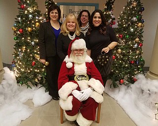 SPECIAL TO THE VINDICATOR
Breakfast with Santa will take place Saturday at Antone’s Banquet Centre in Boardman. Preparing for the event, standing behind Santa from left, are Jennifer Johnson, event co-chairman and area manager of Aqua Ohio; JoAnn Stock, senior director of development; Charlotte Diss, development coordinator; and Jennifer Brindisi, event co-chairman and WFMJ TV-21 anchor. Amy Gasser also is a co-chairman.