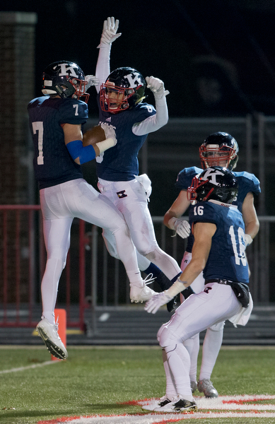 MICHAEL G TAYLOR | THE VINDICATOR- 11-26-16- 4th qtr, JFK's #7  Evan Boyd and JFK's #8 Dan McCartney celebrate Evan Boyd's return of a fumble for a TD.. OHSAA D7 Football Semi  John F Kennedy Eagles vs Canal Winchester Harvest Prep Warriors at Woody Hayes Quaker Stadium in New Philadelphia, OH