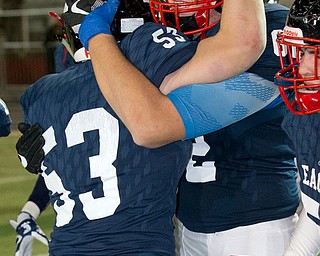 MICHAEL G TAYLOR | THE VINDICATOR- 11-26-16- JFK's #53 Dom Morello and #62 Bruce Johnson celebrates the victory. OHSAA D7 Football Semi  John F Kennedy Eagles vs Canal Winchester Harvest Prep Warriors at Woody Hayes Quaker Stadium in New Philadelphia, OH