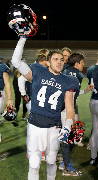 MICHAEL G TAYLOR | THE VINDICATOR- 11-26-16- JFK's #44  Jacob Coates celebrates the victory. OHSAA D7 Football Semi  John F Kennedy Eagles vs Canal Winchester Harvest Prep Warriors at Woody Hayes Quaker Stadium in New Philadelphia, OH.