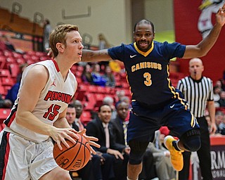 YOUNGSTOWN, OHIO - NOVEMBER 26, 2016: Brett Frantz #15 of YSU looks to shoot after pump faking Martin Dixon-Green #3 of Canisius during the first half of their game Saturday afternoon at the Beeghly Center. DAVID DERMER | THE VINDICATOR