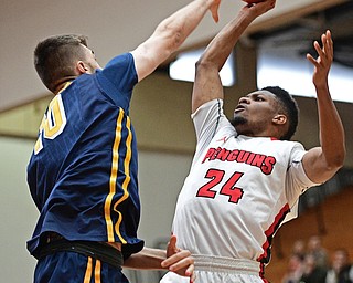 YOUNGSTOWN, OHIO - NOVEMBER 26, 2016: Cameron Morse #24 of YSU has his shot blocked by Selvedin Planicic #10 of Canisius during the first half of their game Saturday afternoon at the Beeghly Center. DAVID DERMER | THE VINDICATOR