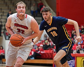 YOUNGSTOWN, OHIO - NOVEMBER 26, 2016: Jorden Kaufman #32 of YSU drives on Selvedin Planicic #10 of Canisius during the first half of their game Saturday afternoon at the Beeghly Center. DAVID DERMER | THE VINDICATOR