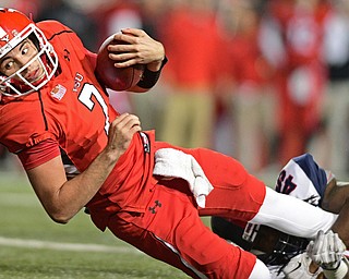 YOUNGSTOWN, OHIO - NOVEMBER 26, 2016: Nathan Mays #7 of YSU looks for the goal line while being tripped up by Shaheed Salmon #45 of Samford during the first half of their playoff game Saturday evening at Stambaugh Stadium. Youngstown State won 38-24. DAVID DERMER | THE VINDICATOR