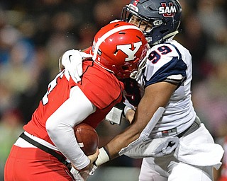 YOUNGSTOWN, OHIO - NOVEMBER 26, 2016: Hunter Wells #6 of YSU is sacked by Ahmad Gooden #99 of Samford during the first half of their playoff game Saturday evening at Stambaugh Stadium. Youngstown State won 38-24. DAVID DERMER | THE VINDICATOR