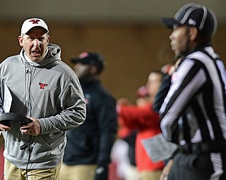 YOUNGSTOWN, OHIO - NOVEMBER 26, 2016: Head coach Bo Pelini of YSU shouts at side judge Eric Hartman during the first half of their playoff game Saturday evening at Stambaugh Stadium. Youngstown State won 38-24. DAVID DERMER | THE VINDICATOR