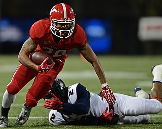 YOUNGSTOWN, OHIO - NOVEMBER 26, 2016: Jody Webb #20 of YSU keeps his balance along the sideline after being hit by Marquis McCullum #2 of Samford during the second half of their playoff game Saturday evening at Stambaugh Stadium. Youngstown State won 38-24. DAVID DERMER | THE VINDICATOR