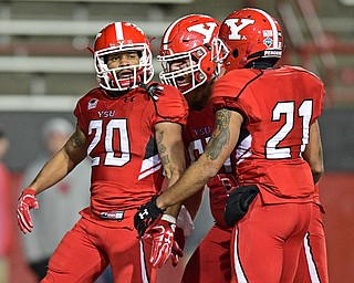 YOUNGSTOWN, OHIO - NOVEMBER 26, 2016: Jody Webb #20 of YSU celebrates with teammates Darien Townsend #21 and Brock Eisenhuth #67 after scoring a touchdown during the second half of their playoff game Saturday evening at Stambaugh Stadium. Youngstown State won 38-24. DAVID DERMER | THE VINDICATOR