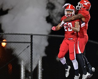 YOUNGSTOWN, OHIO - NOVEMBER 26, 2016: Jody Webb #20 of YSU celebrates with teammate Alvin Bailey #5 after scoring a 62 yard touchdown during the second half of their playoff game Saturday evening at Stambaugh Stadium. Youngstown State won 38-24. DAVID DERMER | THE VINDICATOR