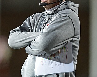YOUNGSTOWN, OHIO - NOVEMBER 26, 2016: Head coach Bo Pelini of YSU watches the action from the sideline during the second half of their playoff game Saturday evening at Stambaugh Stadium. Youngstown State won 38-24. DAVID DERMER | THE VINDICATOR