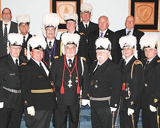 SPECIAL TO THE VINDICATOR
After more than 100 years of Masonic services and meetings at the Masonic Temple on Wick Avenue in Youngstown, all services and meetings will now take place at Argus Masonic Lodge in Canfield. Grand Commandery of Ohio hosted a special ceremony to dedicate the new home of Youngstown Chapter 93, Beuchner Council 107 and St. John’s Commandery 20 to the Canfield location. Chapter members are partners in finding homes for special needs children in support of the Adopt America Network. Council members support several diabetic children’s camps throughout the state, and Commandery members donate to both the Knights Templar Eye Foundation and send ministers throughout the state to Holy Land Pilgrimages. Members of the York Rite continuously strive to be examples of charity and kindness. In front from left, are Dominic Lucarelli; John Craig; Dale Hawkins, commander of St. John’s; Ronald L. Vicars, grand commander of Ohio; George Brainard; Jim Streeky; Brian Williams; and Robert Ellway. In back are Chris Boyd, Russ Gillam, Rich Brady, Randy Emrich, T.A. Brown, Gary Shane and Kenny Jones.