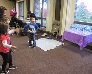 Neighbors | Alexis Bartolomucci.Children participated in the ring toss game during the Halloween Spook-tacular event hosted by West Side Cats on Oct. 21 at Austintown Park.