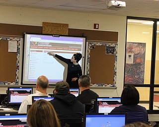 Neighbors | Abby Slanker.Canfield Local School District math coach Shari Ann Munno instructed parents of Hilltop Elementary School students how to find online resources to help their children with the new Bridges Curriculum during Math Night Oct. 13.