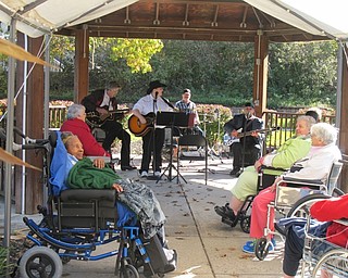 Neighbors | Alexis Bartolomucci.Some of the residents enjoyed the performance from country band Sarah Warner and Friends during the Fall Festival at Beeghly Oaks on Oct. 23.