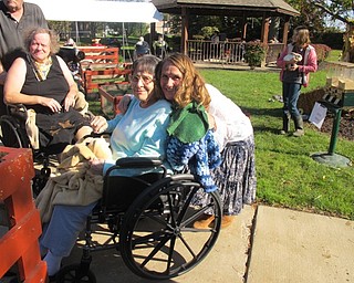 Neighbors | Alexis Bartolomucci.Beeghly Oaks Activities director Maureen McCarty walked around the petting zoo with resident Josephine Markovich during the Fall Fun event at Beeghly Oaks on Oct. 23.