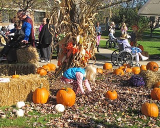Neighbors | Alexis Bartolomucci.One of the children at the Beeghly Oaks Fall Festival on Oct. 23 played in the pumpkin patch.