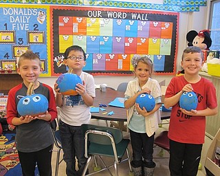 Neighbors | Alexis Bartolomucci.Second-grade students in Alyssa Patrick's class at Poland Union Elementary held up the pumpkins they were working on that they decorated based on a story they read. Pictured are, from left, Renzo, Leonard, Aubrie and Chase.