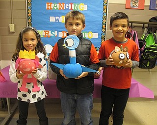 Neighbors | Alexis Bartolomucci.Second-grade students at Poland Union Elementary decorated pumpkins based off of characters from stories they read. Pictured are, from left, Aubrey Blinsky, Dylan Myers and Gavin Seifert.