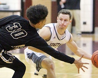 William D. Lewis The vindicator  Boardman's Mike Melewski(4) passes around Hrding's Mike Hughes(30) during 12022016 action at Boardman.