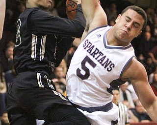 William D. Lewis The vindicator  HArding's Mike Hughes(30) drives past Boardman's Travis Koontz(5) during 12022016 action at Boardman.